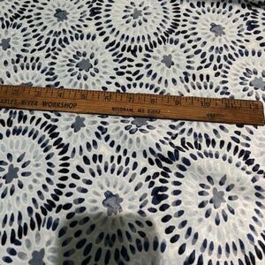 velvet like texture fabric, slightly stretchy with circular patterns